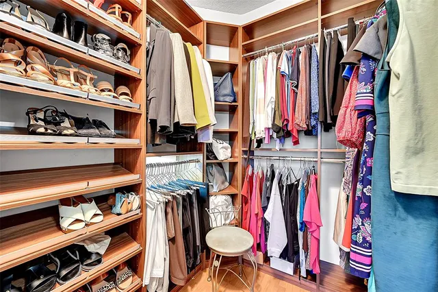 a bathroom with a sink a toilet a mirror and shower curtain