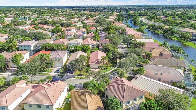 an aerial view of residential houses with outdoor space