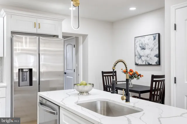 an empty room with a window and a ceiling fan