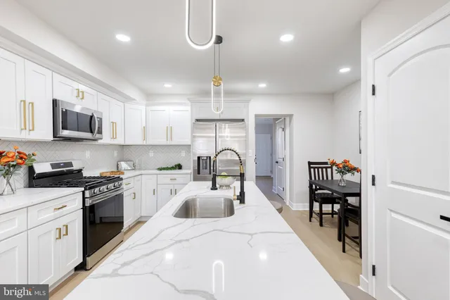 a bedroom with a bed and painting on the wall