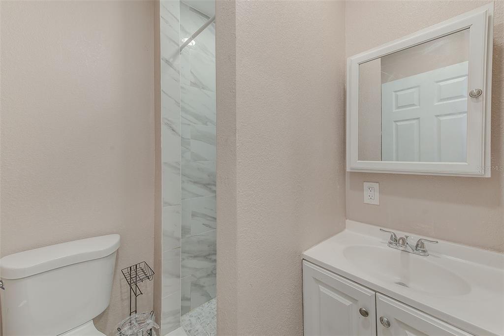 1668 Cleveland Street Clearwater, FL 33755 - Photo 16 of 31 a bathroom with a sink and a toilet