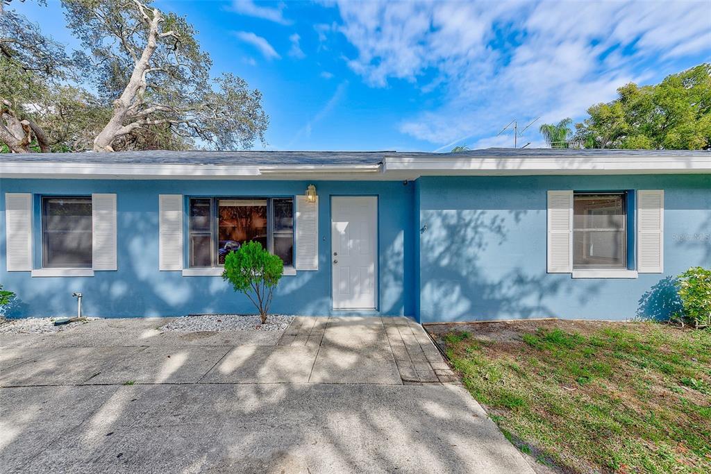 1668 Cleveland Street Clearwater, FL 33755 - Photo 25 of 31 a front view of a house with a yard