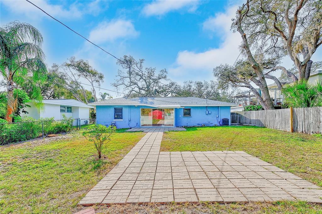 1668 Cleveland Street Clearwater, FL 33755 - Photo 30 of 31 a front view of house with yard and trees