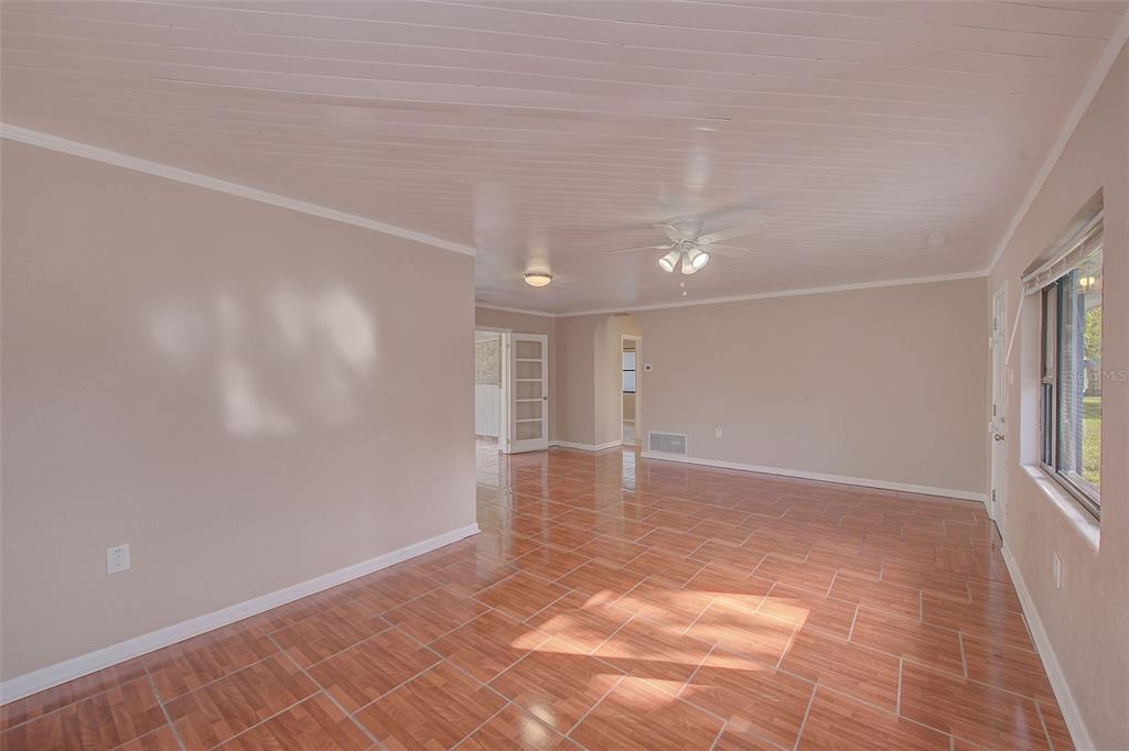 1668 Cleveland Street Clearwater, FL 33755 - Photo 3 of 31 a view of an empty room with a window