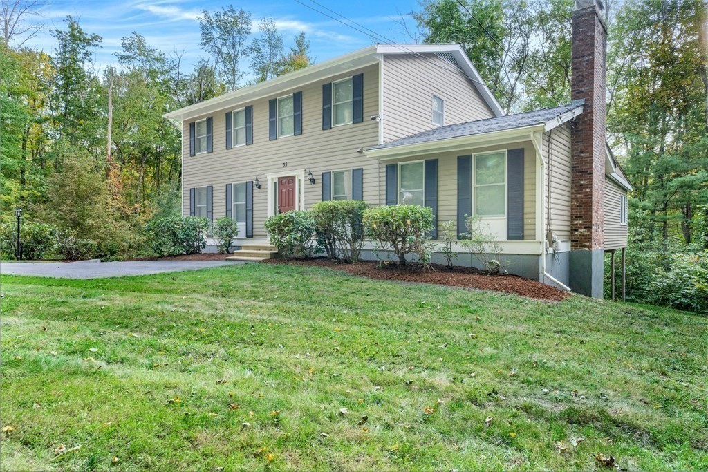 35 Old Village Road Sturbridge, MA 01566 - Photo 1 of 39 a front view of a house with garden and porch