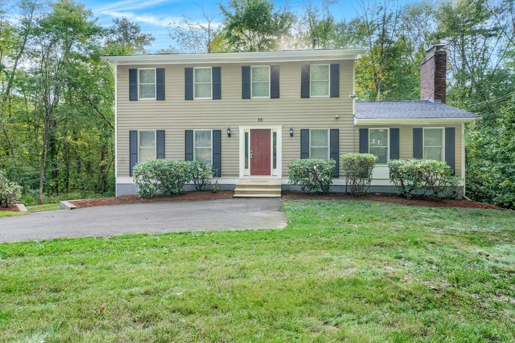 35 Old Village Road Sturbridge, MA 01566 - Photo 2 of 39 a front view of a house with a yard and porch