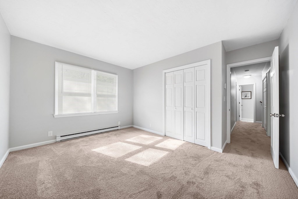 35 Old Village Road Sturbridge, MA 01566 - Photo 24 of 39 an empty room with windows and closet