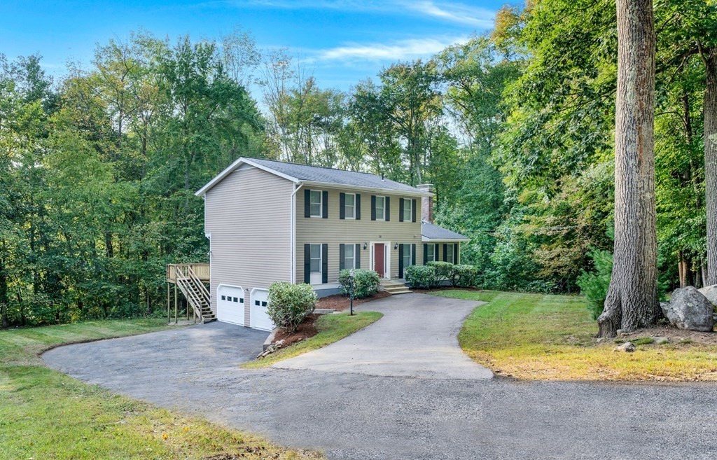 35 Old Village Road Sturbridge, MA 01566 - Photo 33 of 39 a view of a house with backyard and sitting area