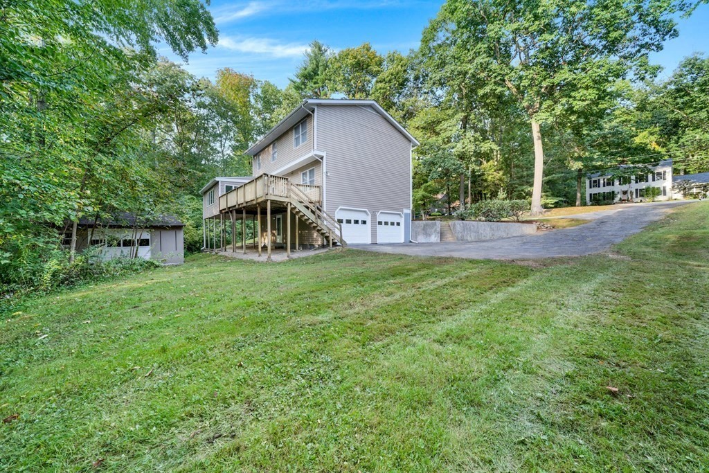 35 Old Village Road Sturbridge, MA 01566 - Photo 34 of 39 a view of a house with a yard and sitting area