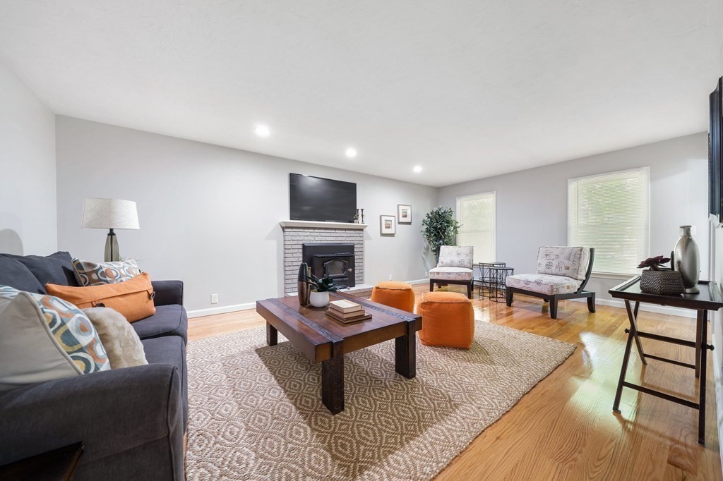 35 Old Village Road Sturbridge, MA 01566 - Photo 9 of 39 a living room with furniture a fireplace and a table