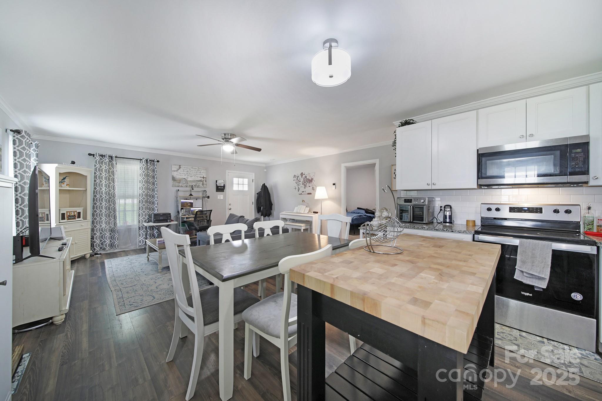 2302 Douglas Road Lancaster, SC 29720 - Photo 11 of 30 a large kitchen with a table and chairs