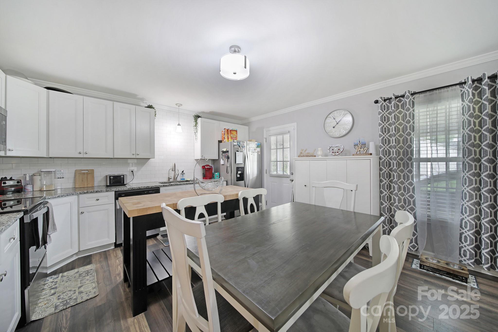 2302 Douglas Road Lancaster, SC 29720 - Photo 13 of 30 a kitchen with a table and chairs in it