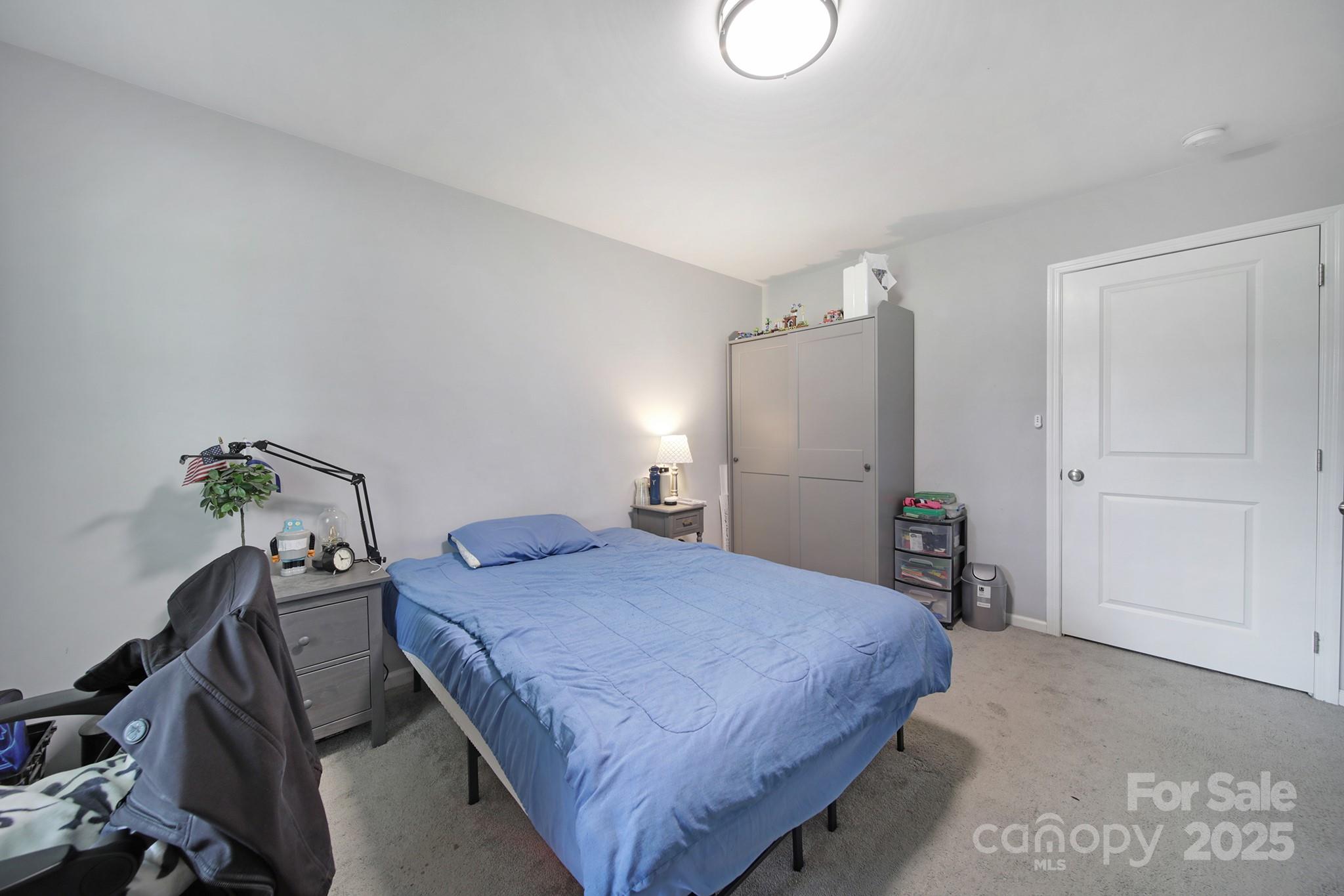 2302 Douglas Road Lancaster, SC 29720 - Photo 18 of 30 a bedroom with a bed and a table in it