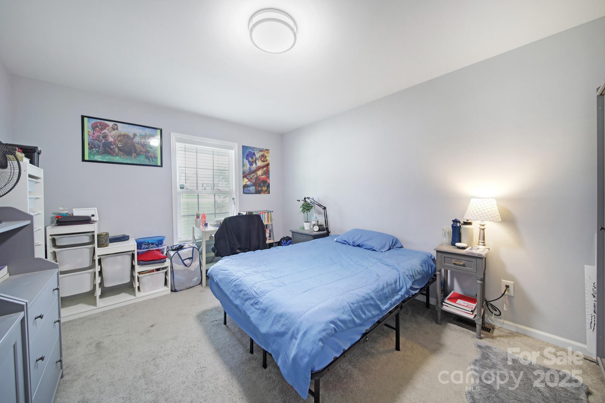 2302 Douglas Road Lancaster, SC 29720 - Photo 19 of 30 a bedroom with a bed a desk and chair
