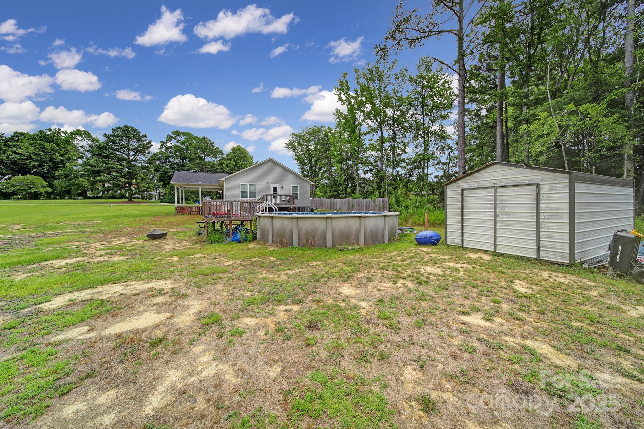 2302 Douglas Road Lancaster, SC 29720 - Photo 25 of 30 a backyard of a house with table and chairs