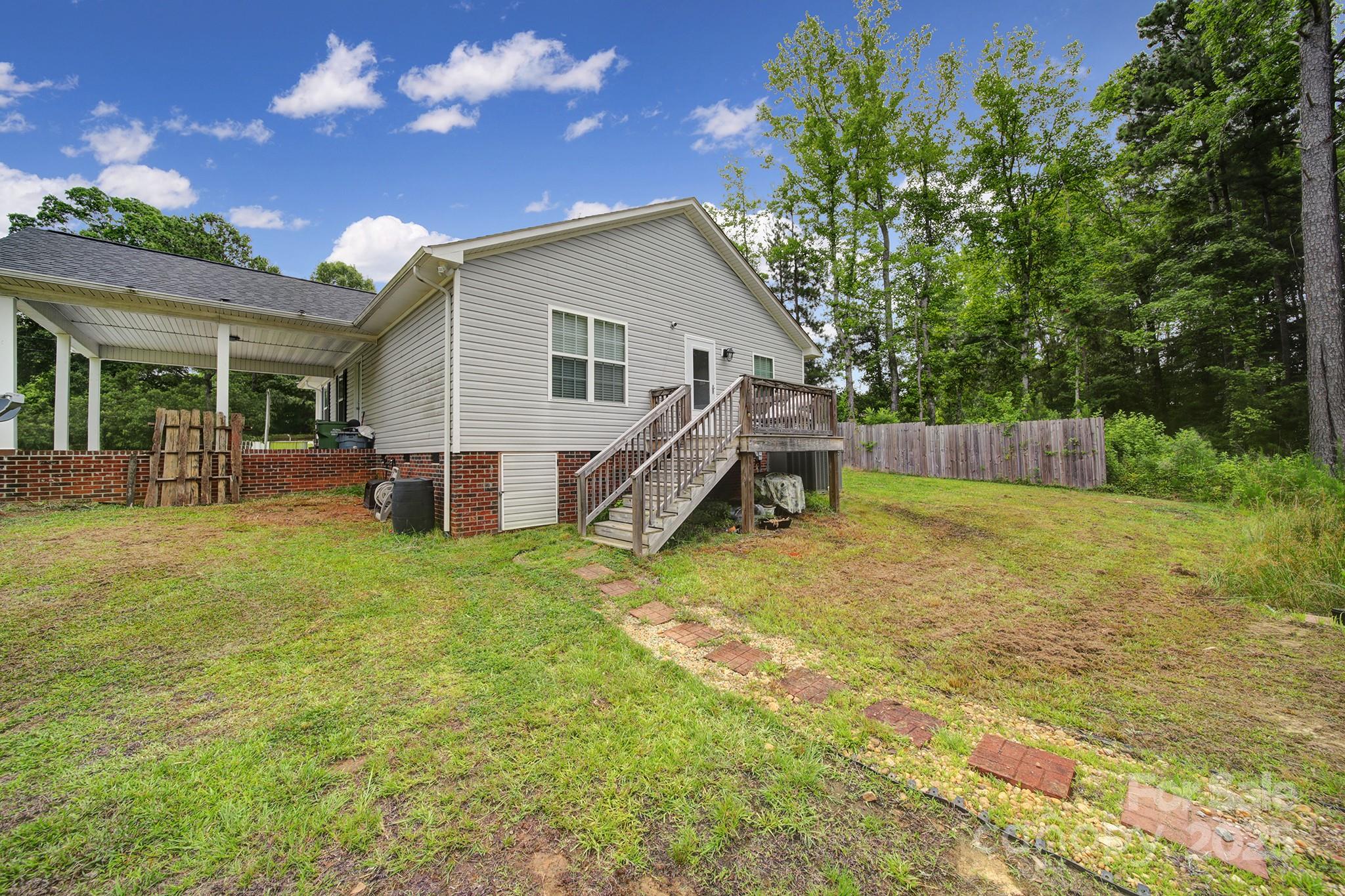 2302 Douglas Road Lancaster, SC 29720 - Photo 26 of 30 a view of a house with backyard and sitting area