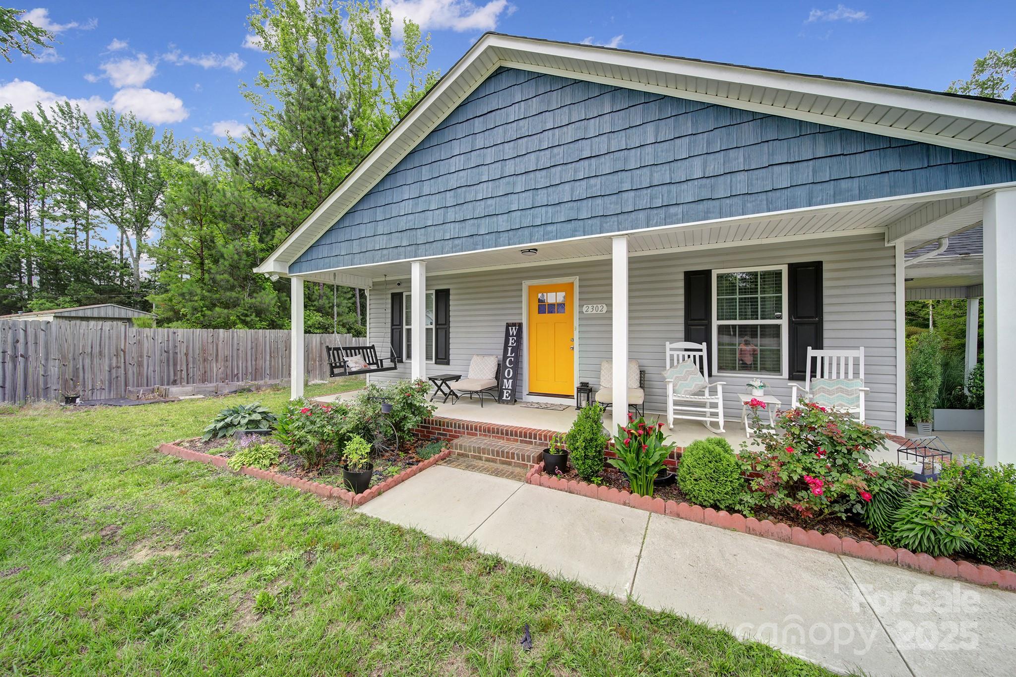 2302 Douglas Road Lancaster, SC 29720 - Photo 3 of 30 a front view of a house with garden