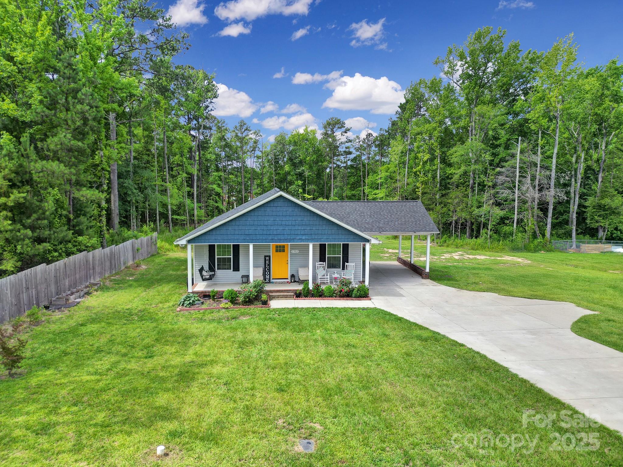 2302 Douglas Road Lancaster, SC 29720 - Photo 4 of 30 a front view of a house with a yard