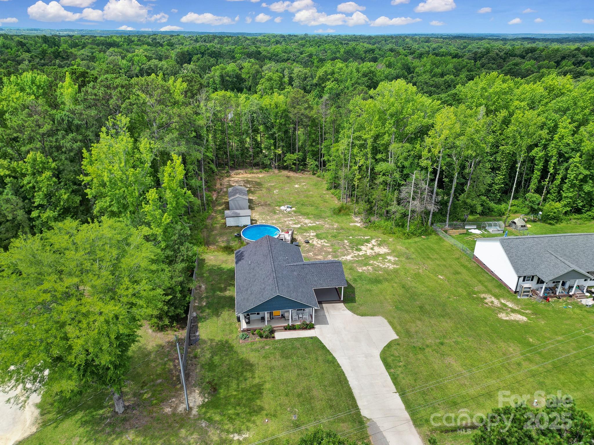 2302 Douglas Road Lancaster, SC 29720 - Photo 6 of 30 a backyard of a house with lots of green space and outdoor seating