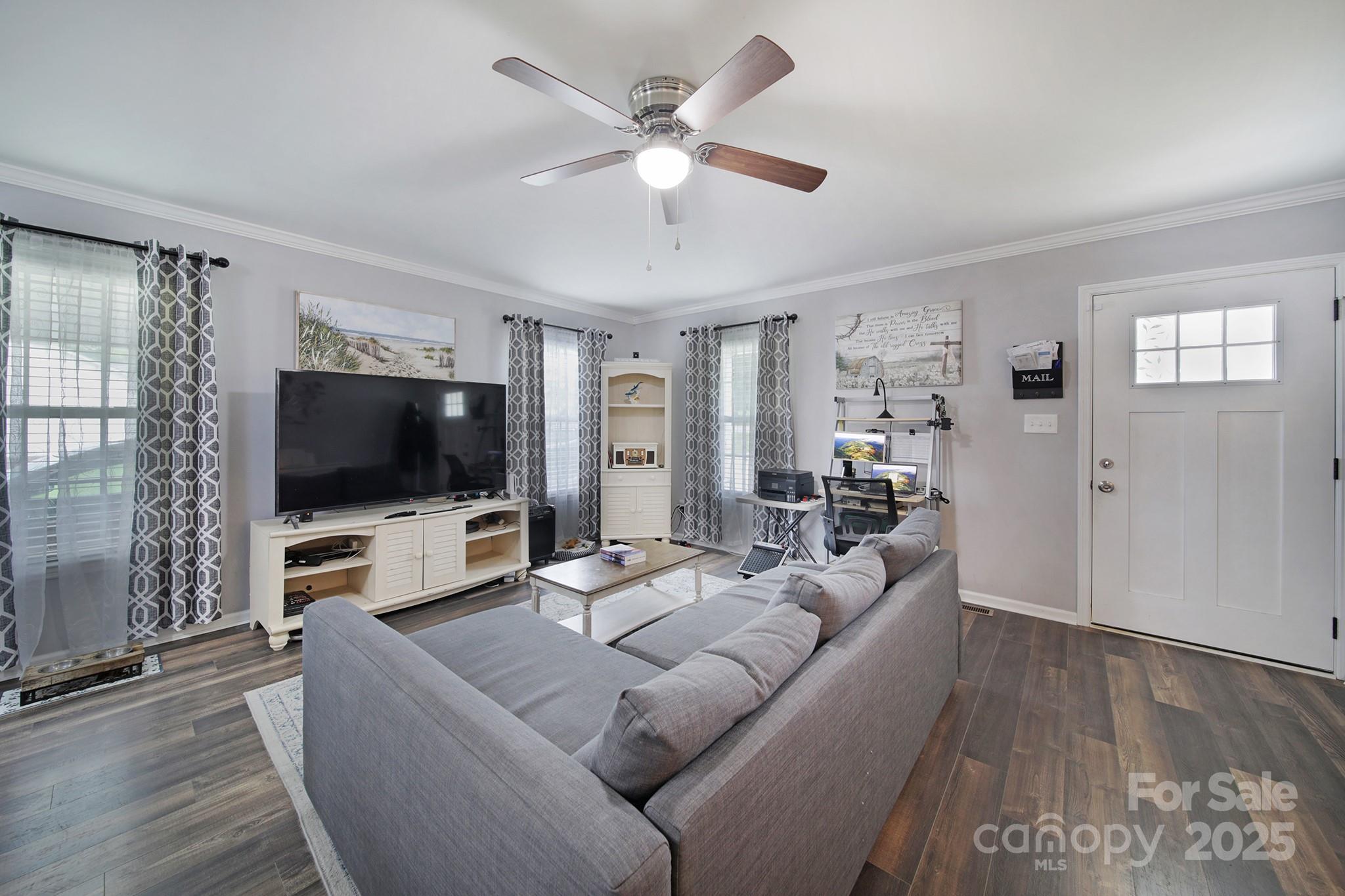 2302 Douglas Road Lancaster, SC 29720 - Photo 8 of 30 a living room with furniture and a flat screen tv
