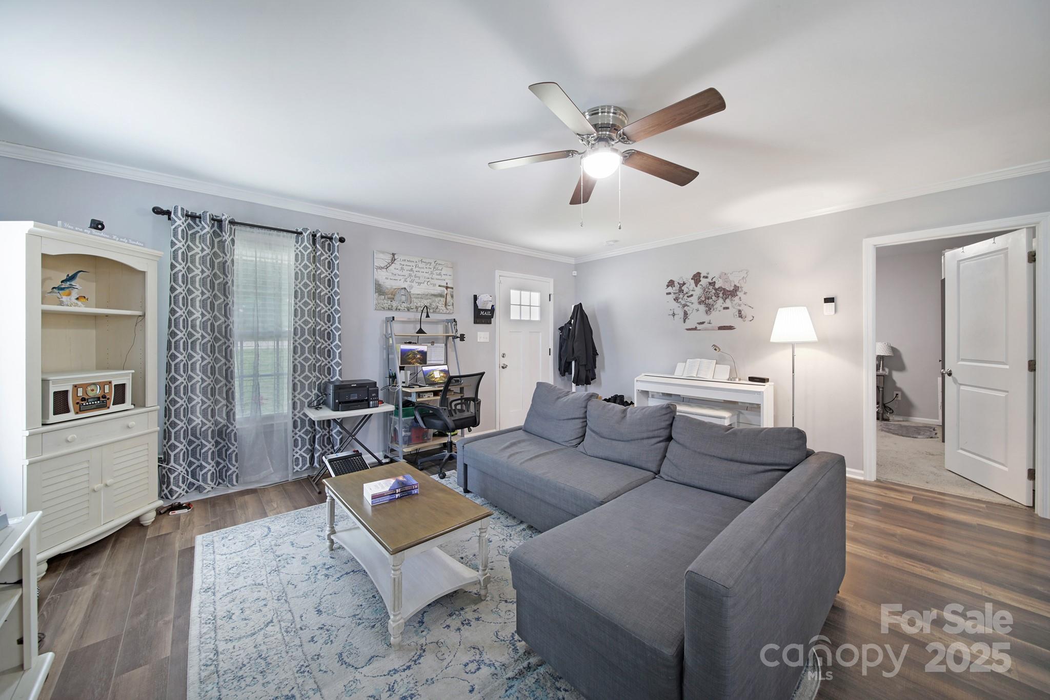 2302 Douglas Road Lancaster, SC 29720 - Photo 10 of 30 a living room with furniture and a wooden floor