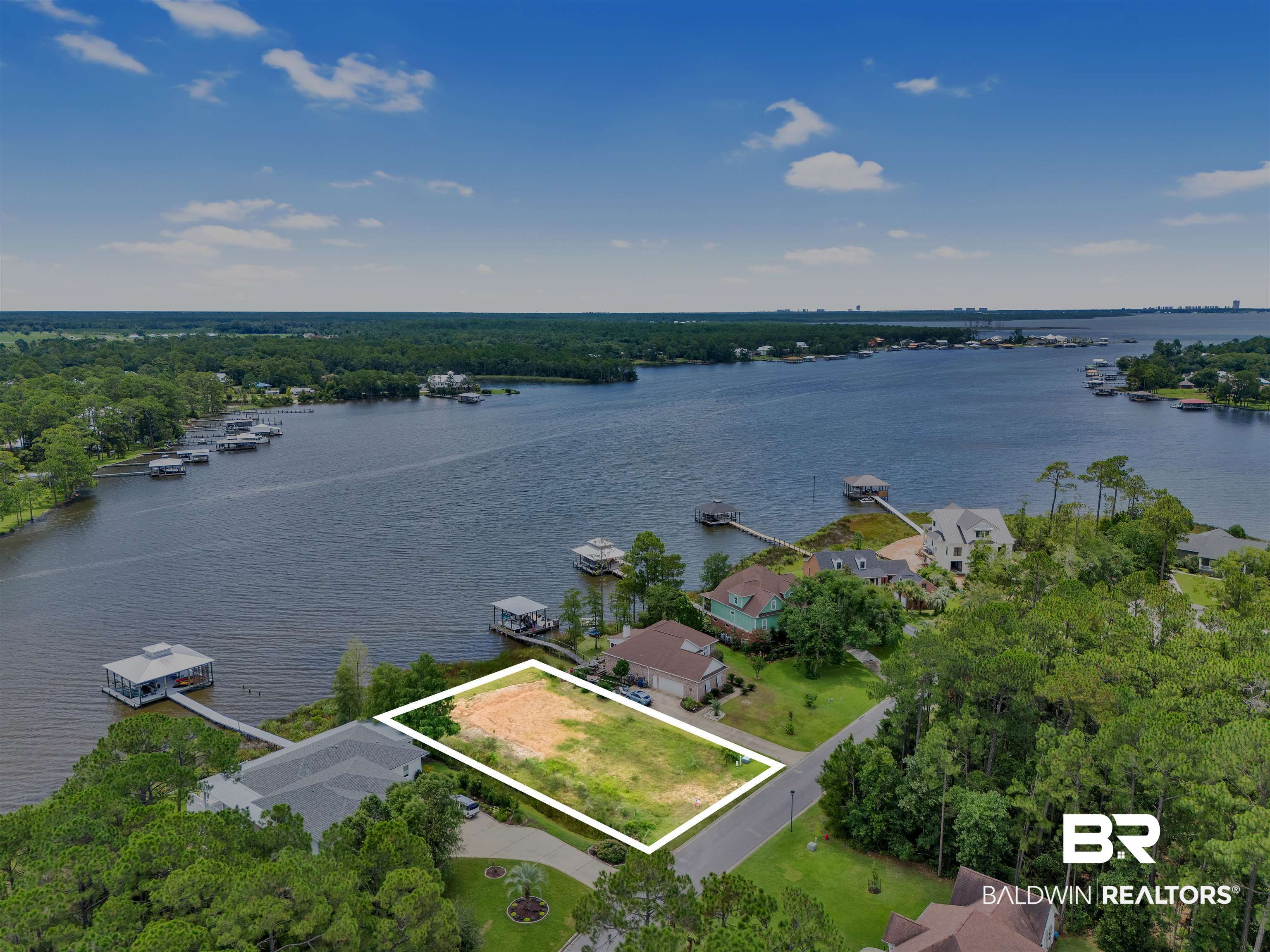8963 Bay Point Drive Elberta, AL 36530 - Photo 1 of 25 Aerial view of property and surrounding area featuring a nearby body of water and property boundaries highlighted