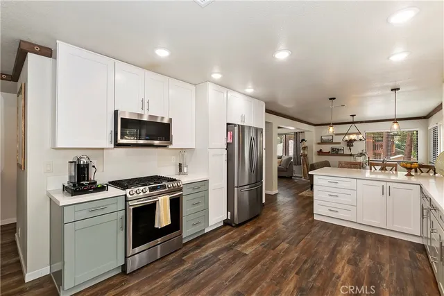 a living room with furniture a fireplace and a large window