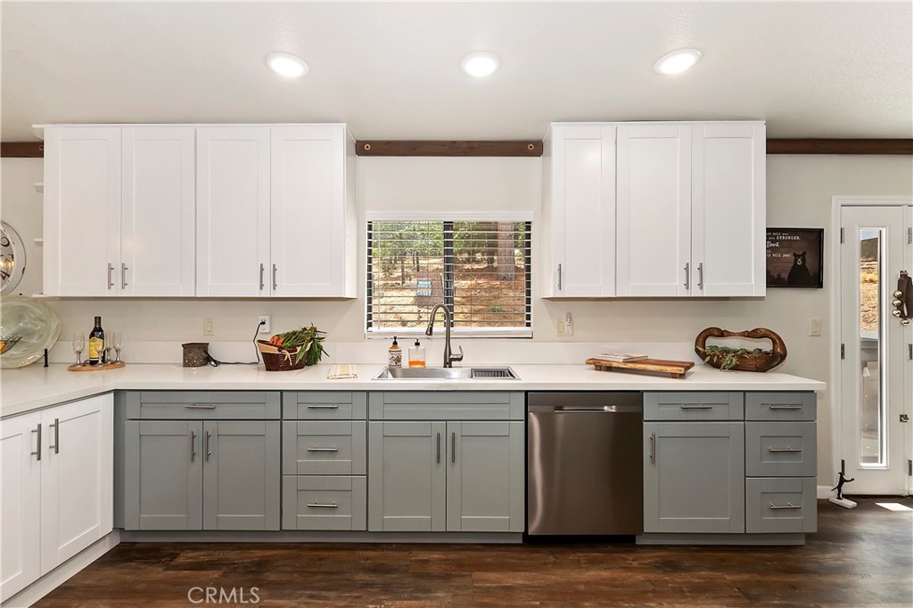 120 Pine Ridge Road Crestline, CA 92325 - Photo 22 of 58 a kitchen with stainless steel appliances a sink stove and cabinets