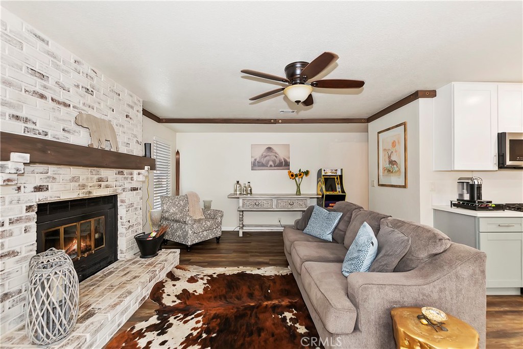 120 Pine Ridge Road Crestline, CA 92325 - Photo 25 of 58 a living room with furniture and a fireplace
