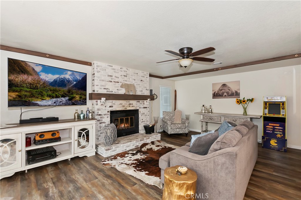 120 Pine Ridge Road Crestline, CA 92325 - Photo 26 of 58 a living room with furniture and a flat screen tv
