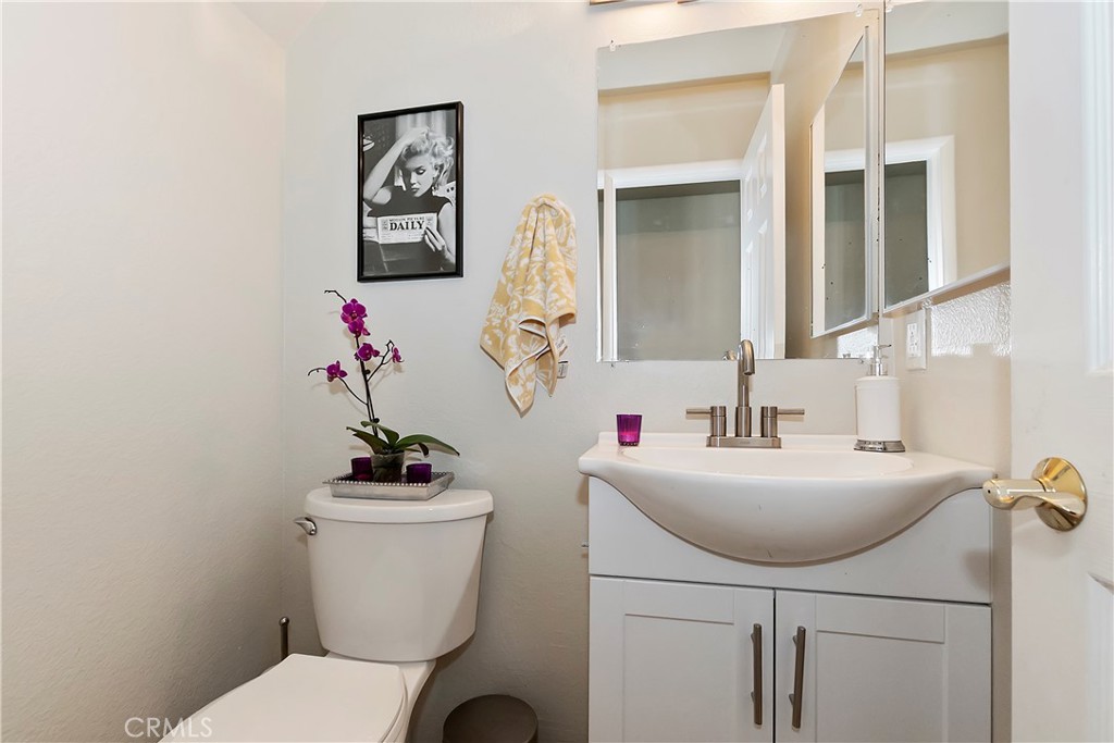 120 Pine Ridge Road Crestline, CA 92325 - Photo 27 of 58 a bathroom with a sink mirror and toilet