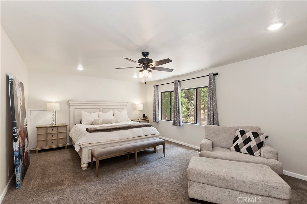 120 Pine Ridge Road Crestline, CA 92325 - Photo 29 of 58 a living room with furniture and a chandelier