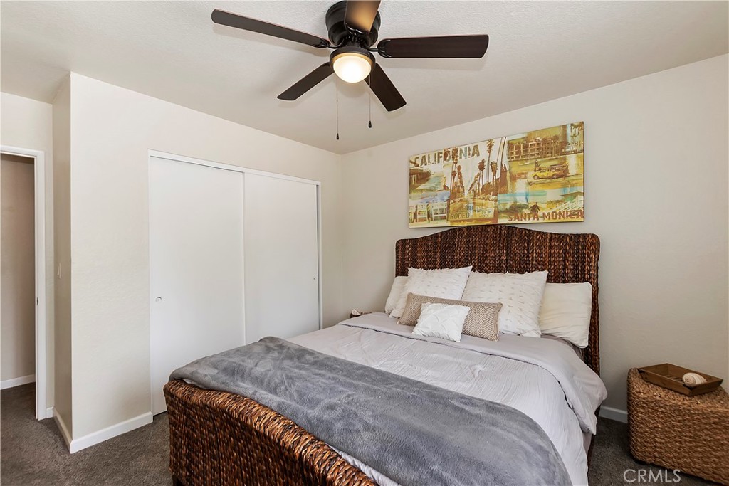 120 Pine Ridge Road Crestline, CA 92325 - Photo 34 of 58 a bedroom with a bed and a ceiling fan