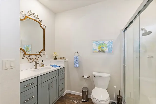 a kitchen with stainless steel appliances granite countertop a sink a stove a microwave and cabinets