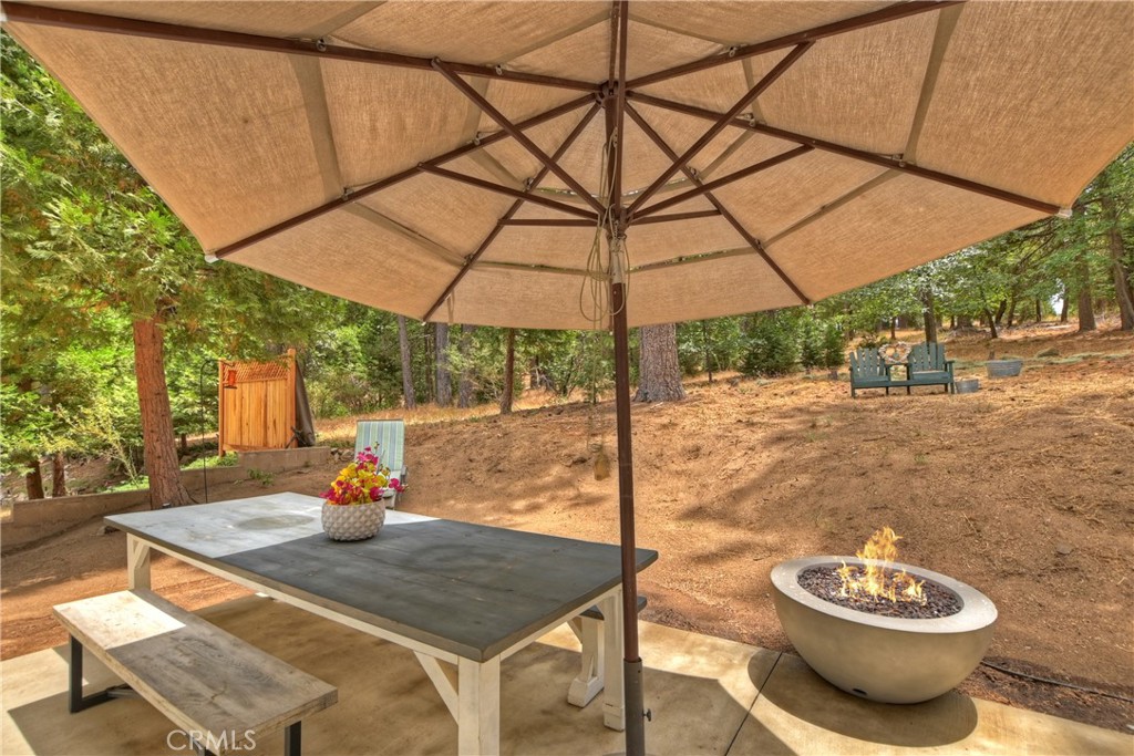 120 Pine Ridge Road Crestline, CA 92325 - Photo 53 of 58 a view of a outdoor space with a table and chairs