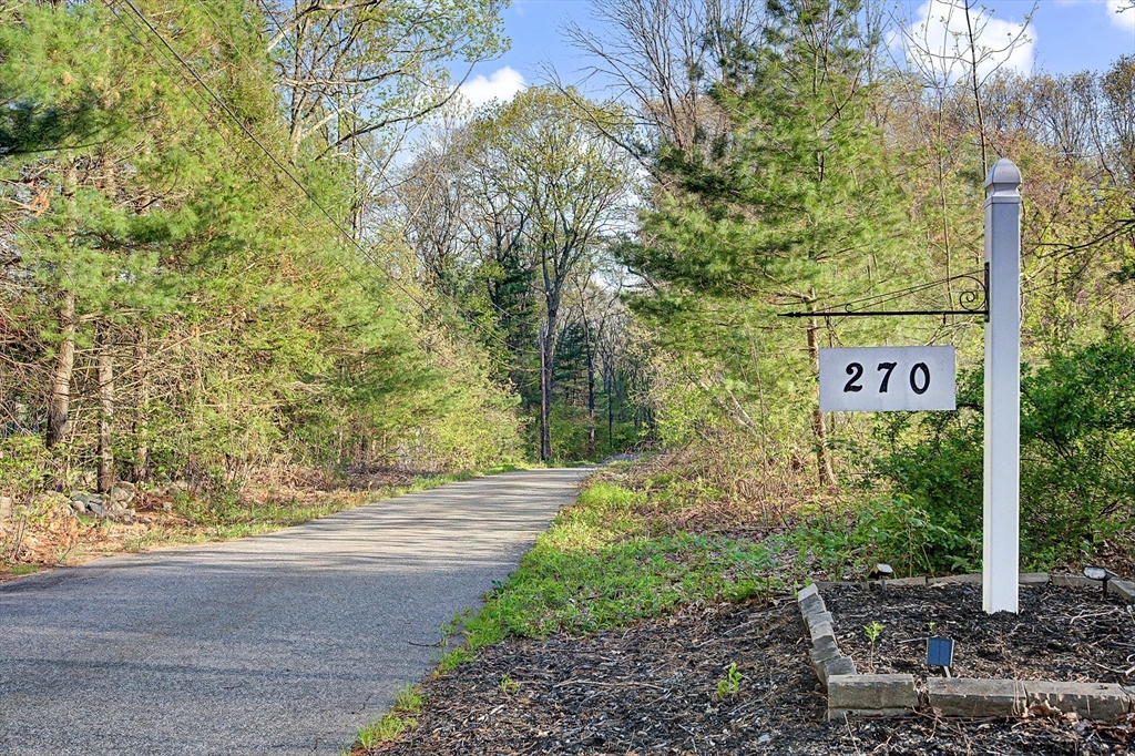 270 Mendon Road Sutton, MA 01590 - Photo 42 of 42 a sign board with tall trees
