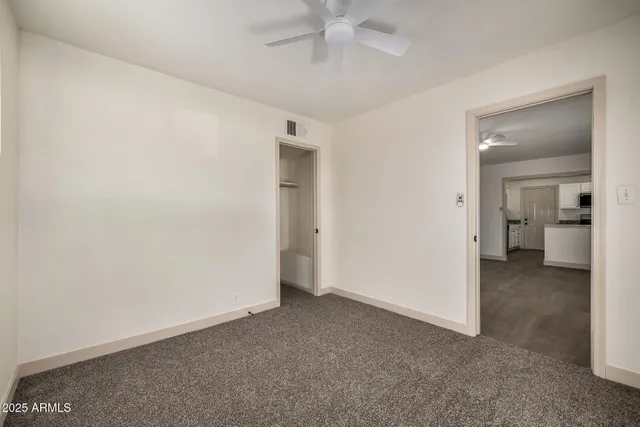 an empty room with a bathroom