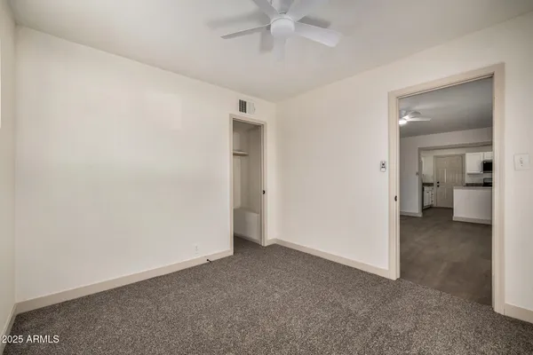 an empty room with a bathroom