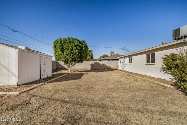 a view of a backyard of a house