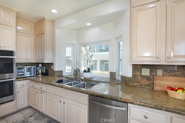 a spacious bedroom with a bed and a large window