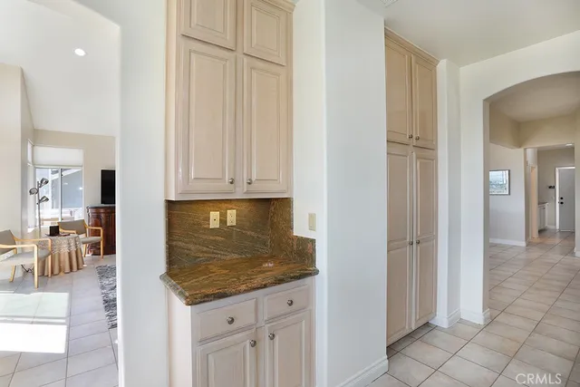 a spacious bedroom with a large bed and a large window