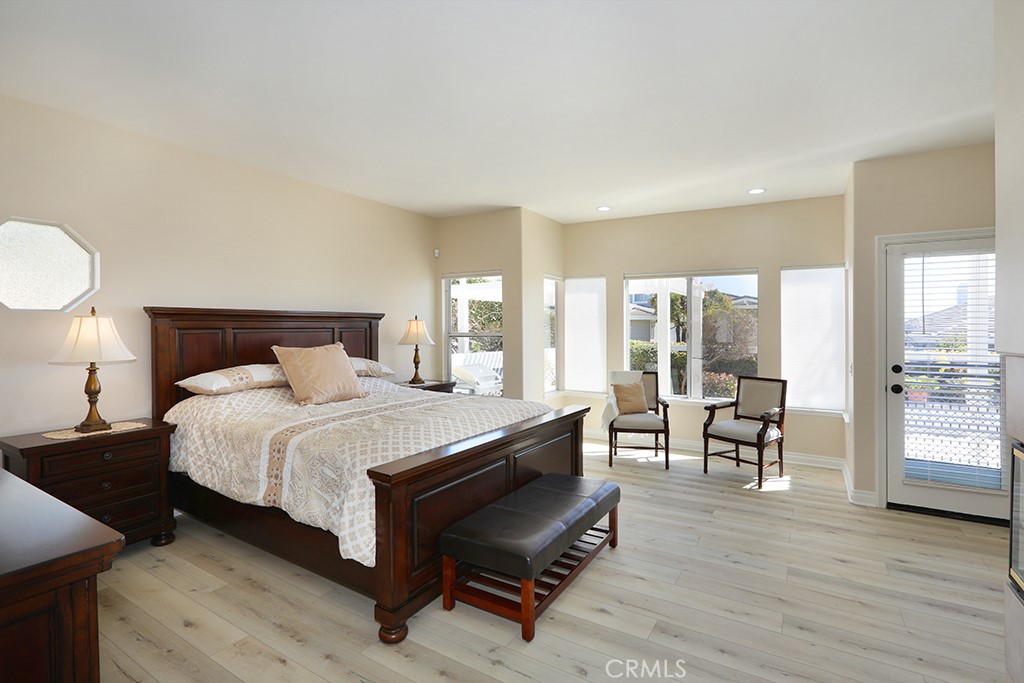 34072 Capistrano By The Sea Dana Point, CA 92629 - Photo 26 of 68 a spacious bedroom with a bed and a large window