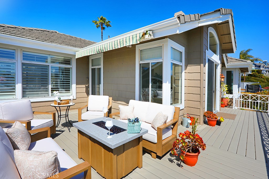 34072 Capistrano By The Sea Dana Point, CA 92629 - Photo 7 of 68 a view of a patio with couches table and chairs and potted plants