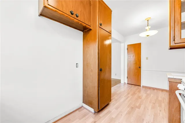 a view of hallway with wooden floor