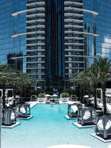 a view of a swimming pool with furniture