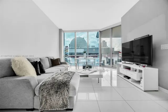 a living room with furniture and a flat screen tv