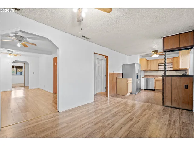 a view of a kitchen with wooden floor