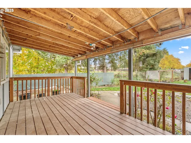 a view of balcony with wooden floor