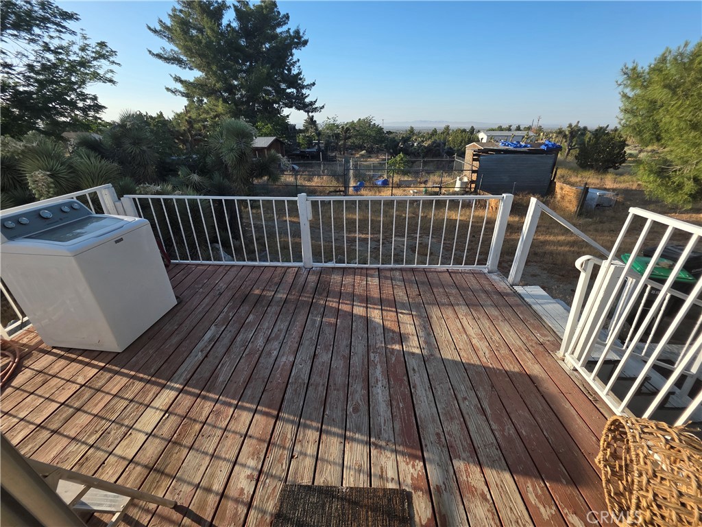 10623 Desert View Road Pinon Hills, CA 92372 - Photo 37 of 76 a view of balcony with wooden floor
