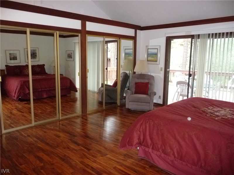 979 Cart Court Incline Village, NV 89451 - Photo 11 of 34 a bedroom with a bed and wooden floor